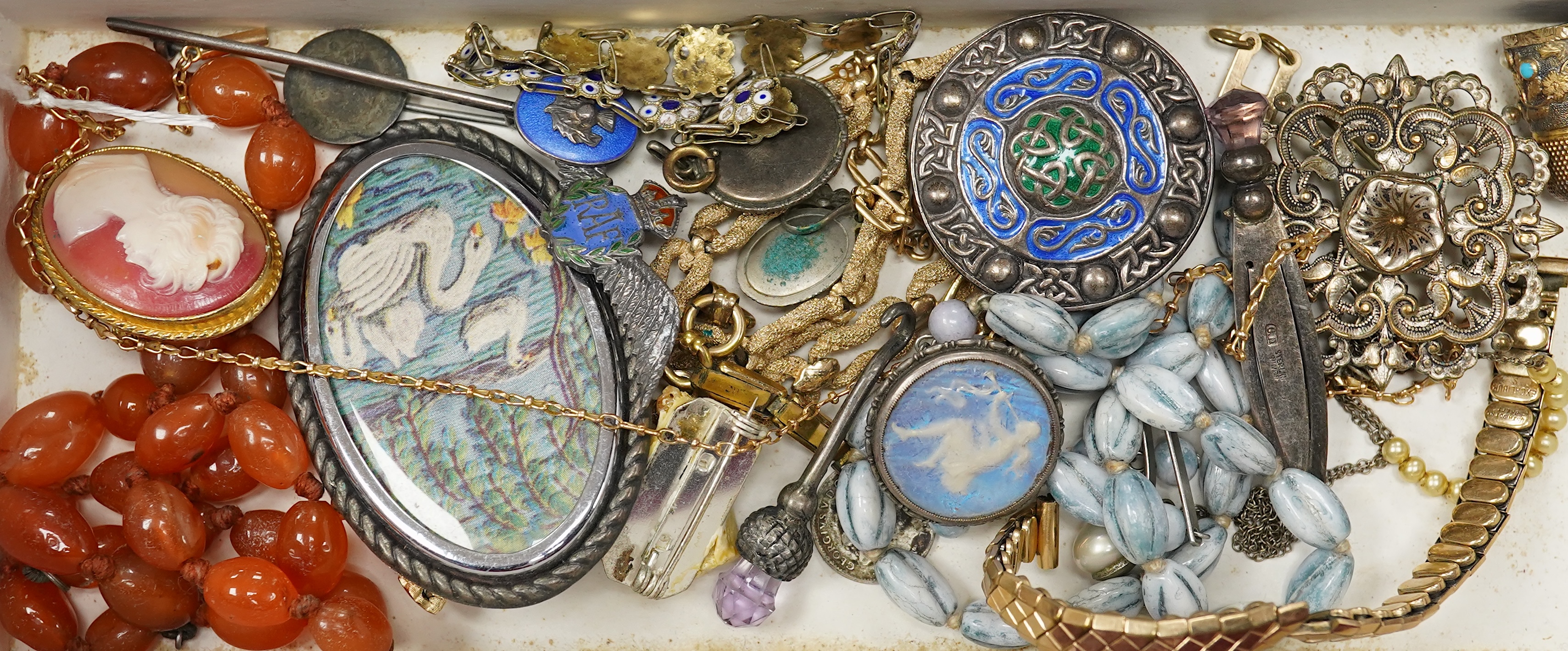 A mixed group of jewellery, including a yellow metal chain stamped 15c, 4.5 grams, a 9ct 'H' charm, a George VI silver and enamel Celtic style brooch, by A H Darby & Son, a sterling book mark, an agate bead necklace and